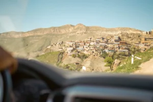 a view of a village from a vehicle