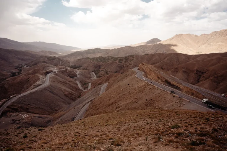 a view of a winding road in the mountains