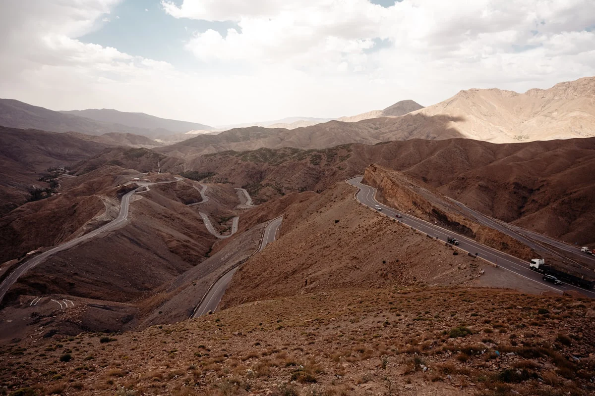 a view of a winding road in the mountains