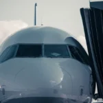 A large jetliner sitting on top of an airport tarmac