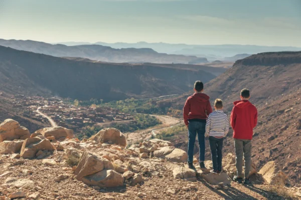 a group of people standing on top of a mountain
