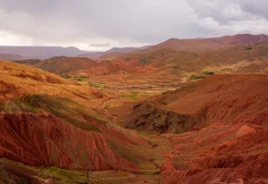 A view of a valley with a mountain in the background