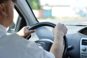 Hand on steering wheel