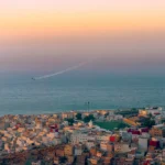 A beautiful picture of a stadium in front of a sea in Morocco Al Hoceima..