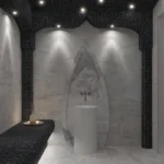 a bathroom with a white tub and a black counter
